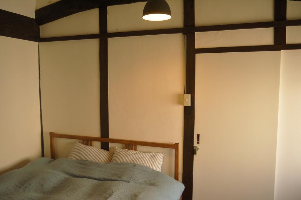 Minatoya Guesthouse Iki Ruang foto
